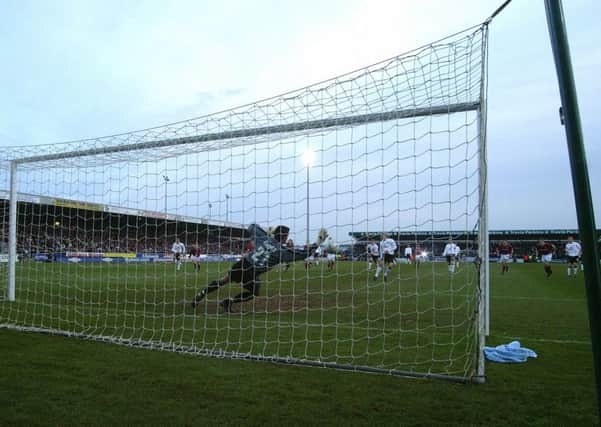 HIGH POINT - Lee Harper saves Diego Forlan's early penalty at Sixfields (Pictures: Pete Norton)