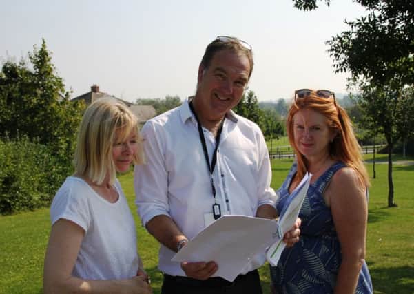 From left: Artist Wendy Briggs with DDCs community development co-ordinator Tim Cantwell and the secretary of the Middlemore Residents Association, Karen Tweedale