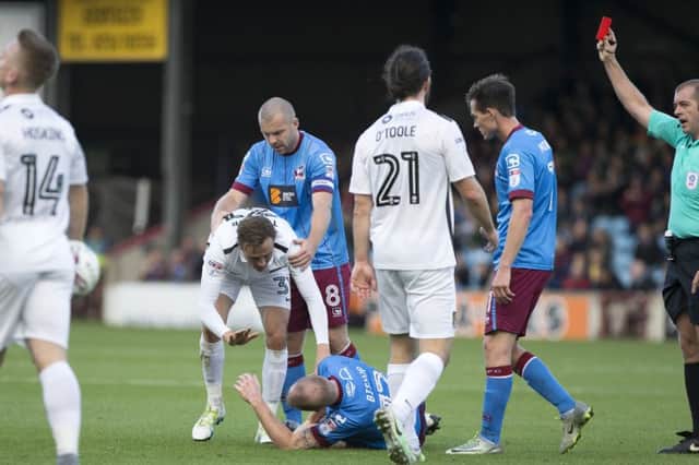 EARLY BATH: Matty Taylor's red card was the big talking point at Glanford Park. Pictures: Kirsty Edmonds