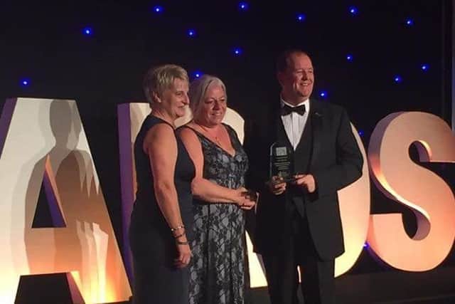 The team picking up their award