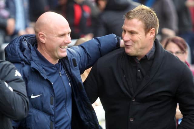 ALL SMILES: Rob Page and his counterpart David Flitcroft share a pre-match joke. Pictures: Sharon Lucey
