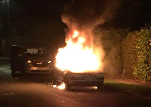 The car alight in the street