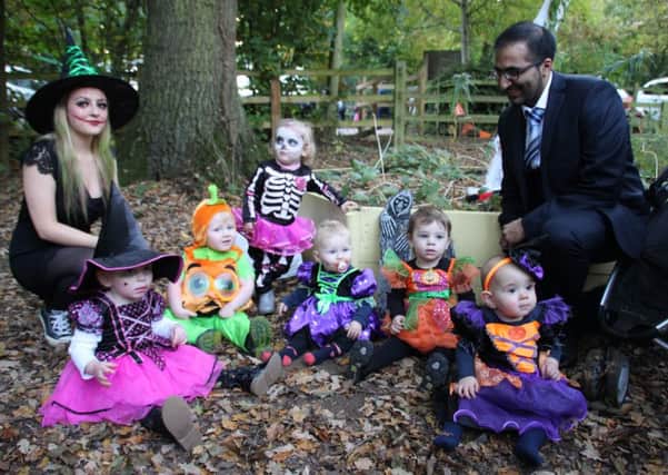 Some of the youngsters who went along to the Spooktacular with Satvinder Soomal Director of Specsavers Daventry with in-store trainer at the store Amy Pow
