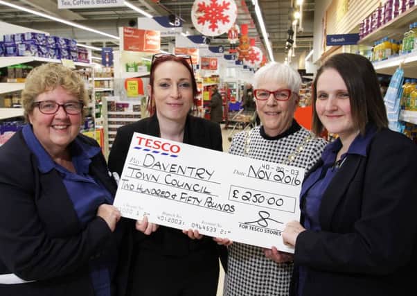 Tesco colleagues Linda Dodsworth, Kirsty Francis and Laura O'Neill present the Â£250 cheque to Mayor of Daventry, Glenda Simmonds