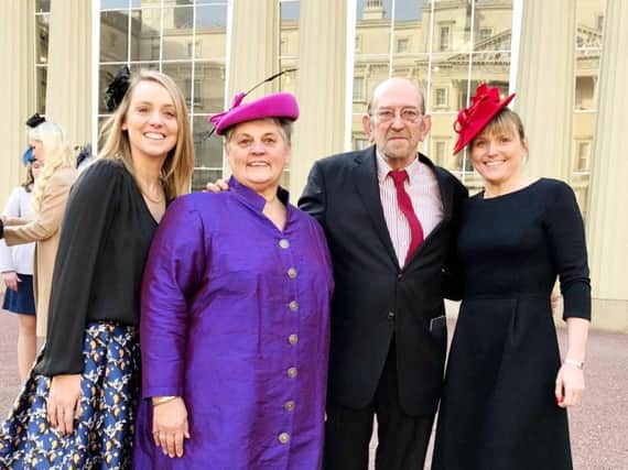 Cllr Caryl Billingham MBE (in purple), with family and friends at Buckingham Palace