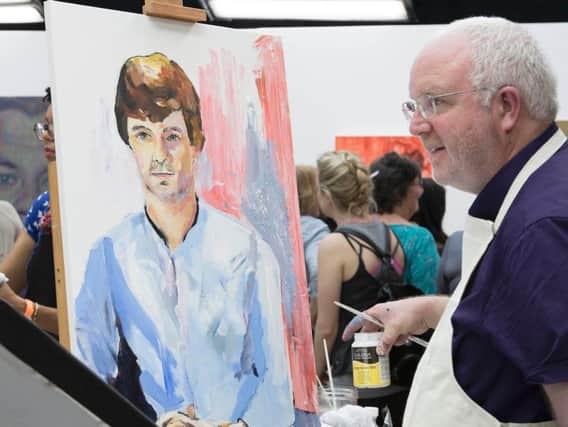 David Douglas with his portrait of Freddie Highmore