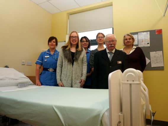 Representatives from Danetre Hospital, The Friends of Danetre, and the Gary Barton Memorial Trust, with one of the new hi-lo beds.