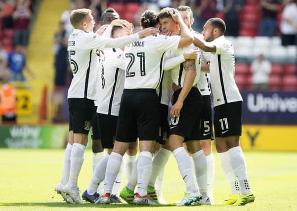 The Cobblers players celebrate Alex Revell's goal in the 1-1 draw at Charlton in August