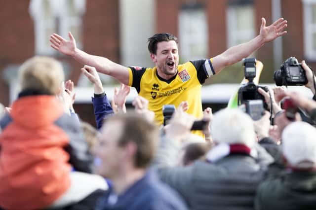 Dave Buchanan celebrates the Cobblers sealing promotion at Exeter City last season