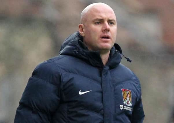 Rob Page, pictured during his final game as Cobblers boss, a 5-0 defeat at Bristol Rovers on January 7