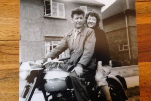 Margaret rides on the back of George's Triumph Speed Twin