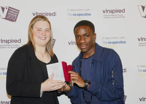 Tinchy Stryder presents an award at the V Inspired 2012 national awards in London