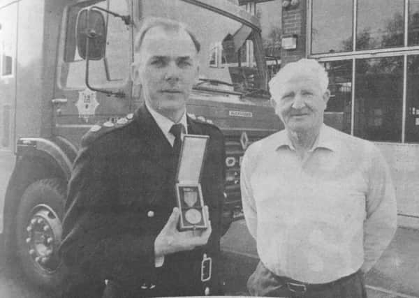 Assistant divisional fire officer Keith Hand alongside fellow Germany tripper Doug Abbott