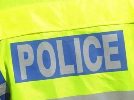 A road rage driver shouted 'racist insults' and reversed into delivery van causing damage in Daventry.