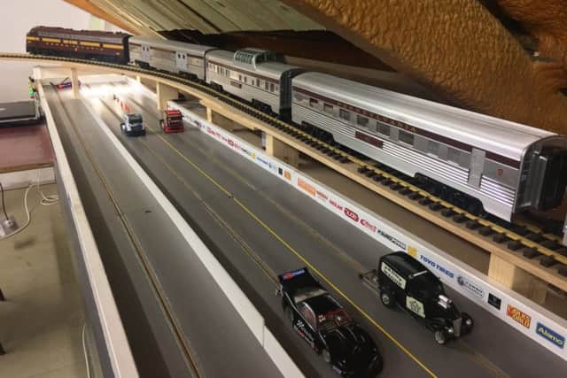 The club has a drag track and a model railway line that circles its mezzanine.