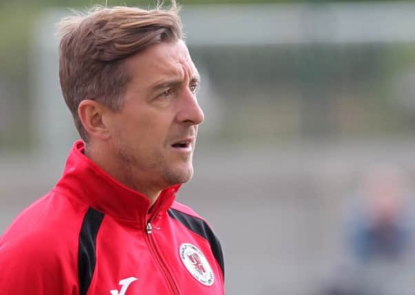 Jon Brady has taken up a full-time coaching role at the Cobblers