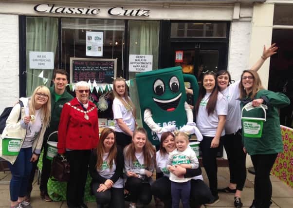 Support from Classic Cutz in Sheaf Street, with Cllr Glenda Simmonds, Macmillan Fundraisers and Muggy, Macmillan Mascot.