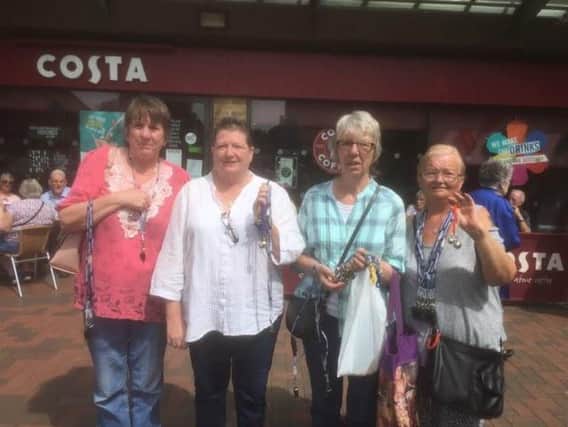 Irene Gardner (second from the right) and the other volunteers out in Daventry handing out their anti-theft items.