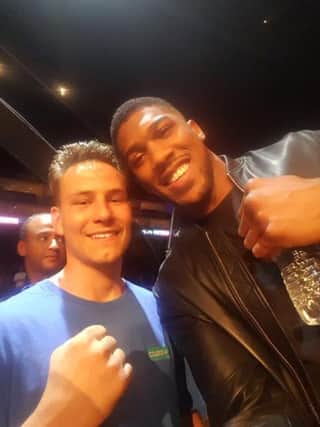 Michael Cole with heavyweight world champion Anthony Joshua after his fight at the O2 Arena.