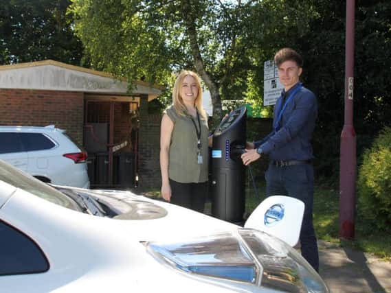 Daventry District Council's environmental improvement Officer Joely Slinn with operations assistant Rob Burton at the new electric vehicle charging point in Lodge Road.