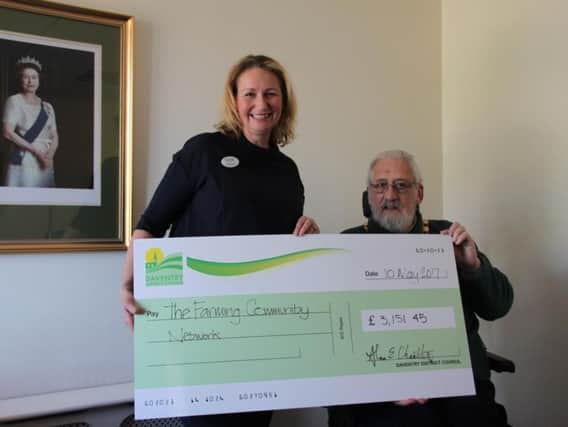 Vicki Beers received the cheque from Councillor Alan Chantler