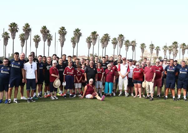 IN IT TOGETHER - the Cobblers squad and supporters met up at Oliva Nova on Thursday evening (Picture: Pete Norton)