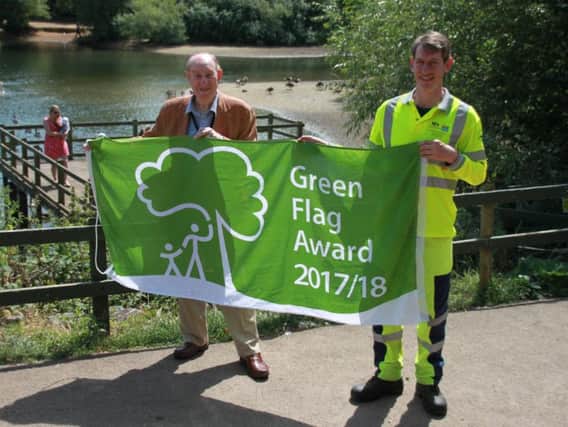 Councillor Alan Hills with the Green Flag