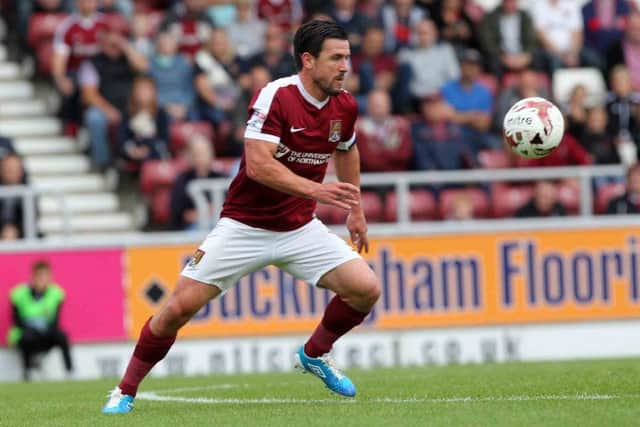 EYE ON THE BALL: David Buchanan has had things all his own way in the two years he's been at Sixfields, but summer signing George Smith may provide stiff competition in 2017/18