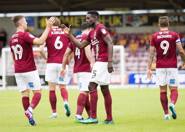 JOB DONE - Chris Long and Leon Barnett celebrate the Cobblers' winning goal at Sixfields on Saturday (Pictures: Kirsty Edmonds)