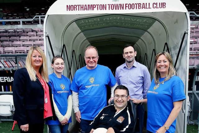 Lisa Hust (NTFC commercial exec.), Kinga Jastrzebska (Amazon Daventry), Daventry Fulfilment Centre manager David Tindal, James Whiting (NTFC chief executive) and Rachel Kelly (Amazon Daventry) with supporter Mustafa El-Bayati