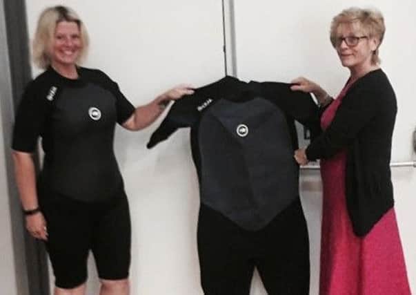 A year ago Becci wore a XXX men's wetsuit, now she's slimmed down an L women's suit.