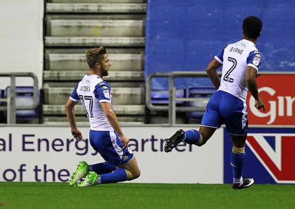 Wigan's Michael Jacobs slides on his knees to celebrate his spectacular goal against the Cobblers on Tuesday night (Pictures: Sharon Lucey)