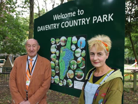 Councillor Alan Hills with Nina Cashmore and one of the new maps which have gone on display throughout the park.