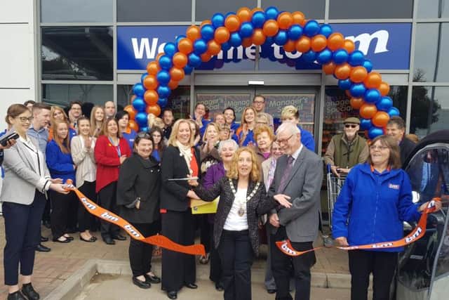 Daventry Mayor Lynne Taylor cuts the store's ribbon
