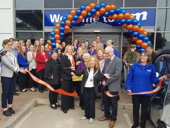 Daventry Mayor Lynne Taylor cuts the store's ribbon