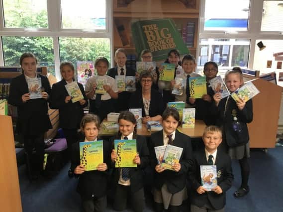 Pupils at Falconer's Hill Academy with children's author Gillian Overitt