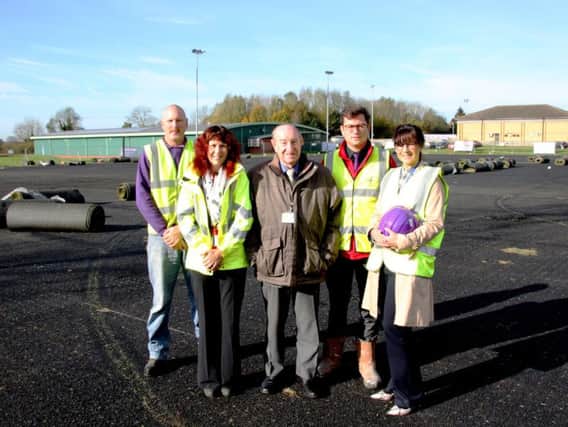 From left: Matt Hodgson of contractors SIS Pitches, DDCs contracts & performance manager Julie Lewis, Councillor Alan Hills, Everyone Actives general manager at Daventry Leisure Centre Jamie Brightwell, and sports & activity strategy officer at DDC, Mel Bland.