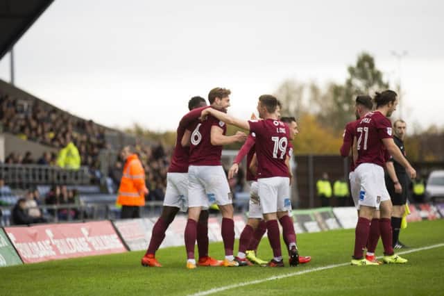 Cobblers celebrate Ash Taylor's opener. Pictures: Kirsty Edmonds